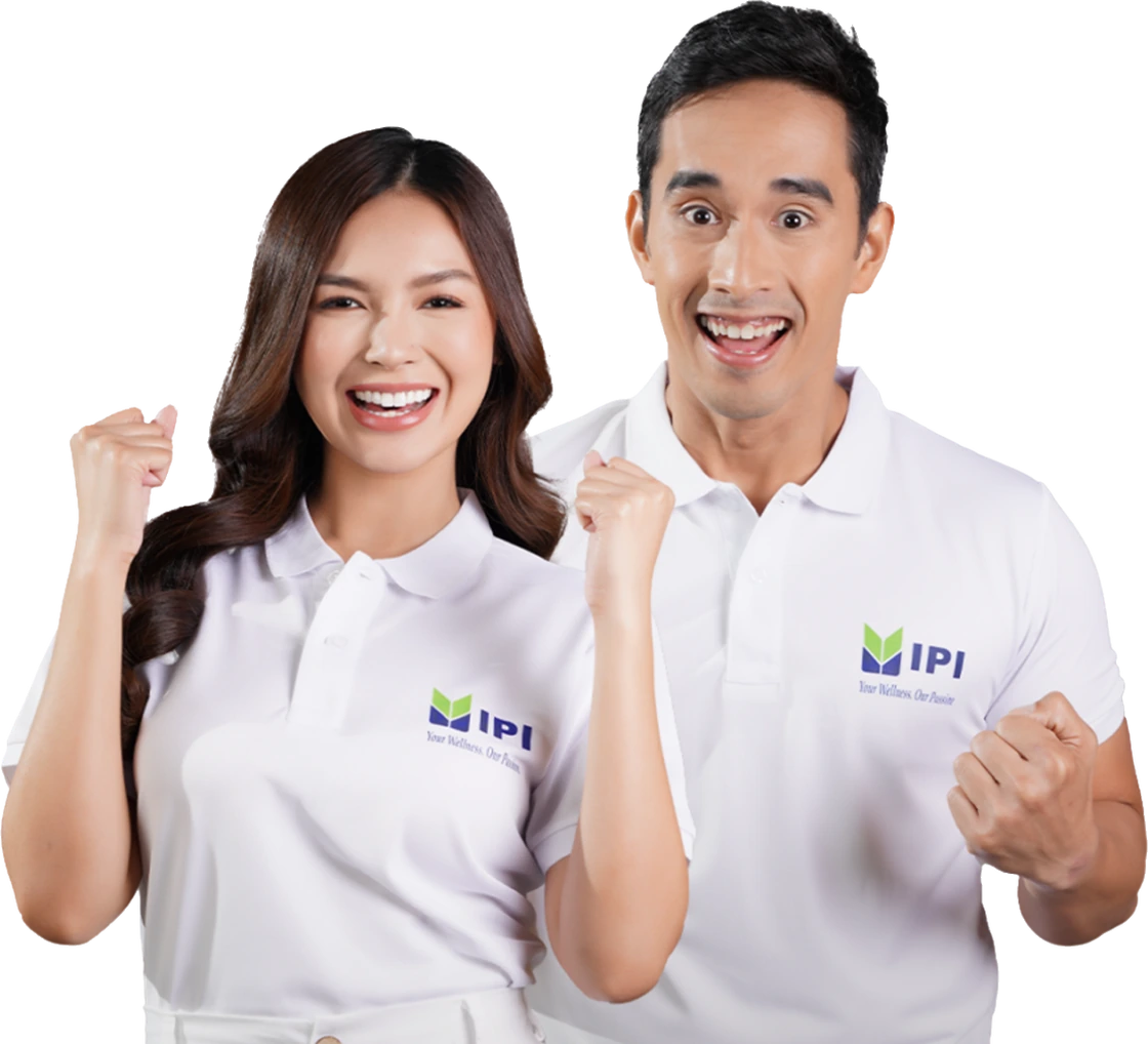 Two people wearing IPI-branded polo shirts celebrating with raised fists.