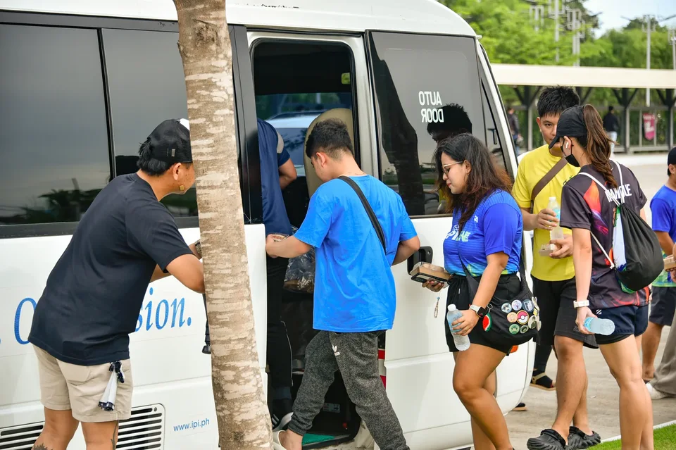 IPI employees planting mangrove propagules by hand across a tidal flat during the company’s EcoWellness mangrove planting day