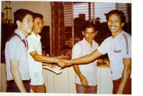 An archive photograph from IPI’s early decades, showing staff at the company’s Cebu premises and at company gatherings