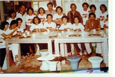 An archive photograph from IPI’s early decades, showing staff at the company’s Cebu premises and at company gatherings