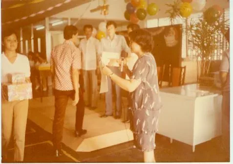 An archive photograph from IPI’s early decades, showing staff at the company’s Cebu premises and at company gatherings
