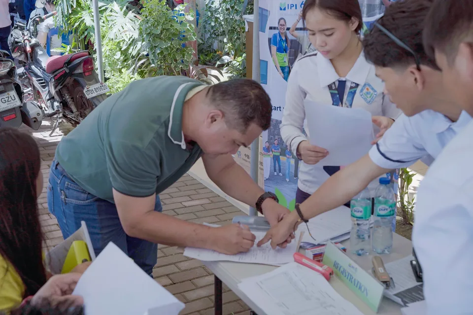 Applicants completing forms and meeting IPI recruiters at a PESO special recruitment activity held under tents in the city grounds