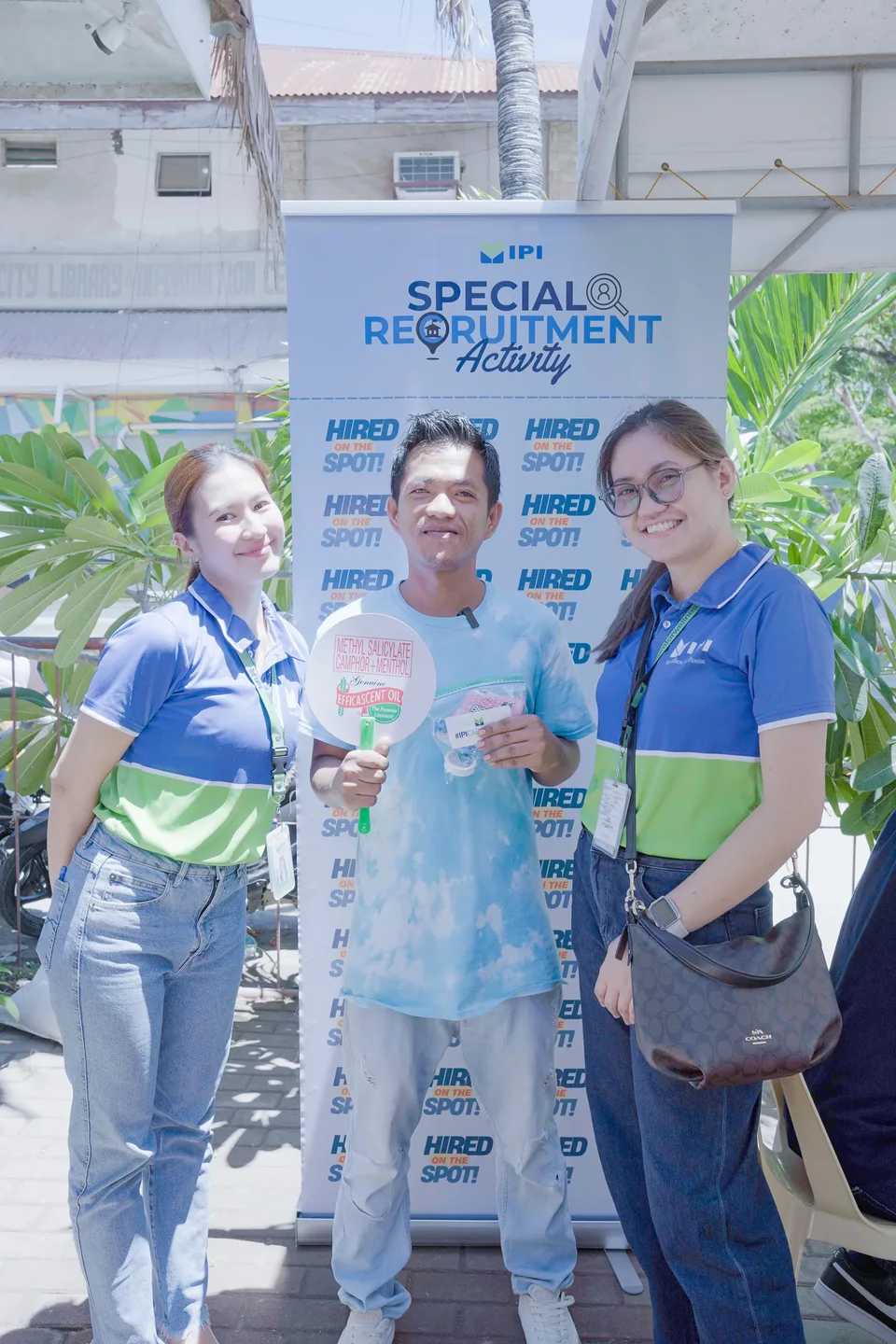 Applicants completing forms and meeting IPI recruiters at a PESO special recruitment activity held under tents in the city grounds