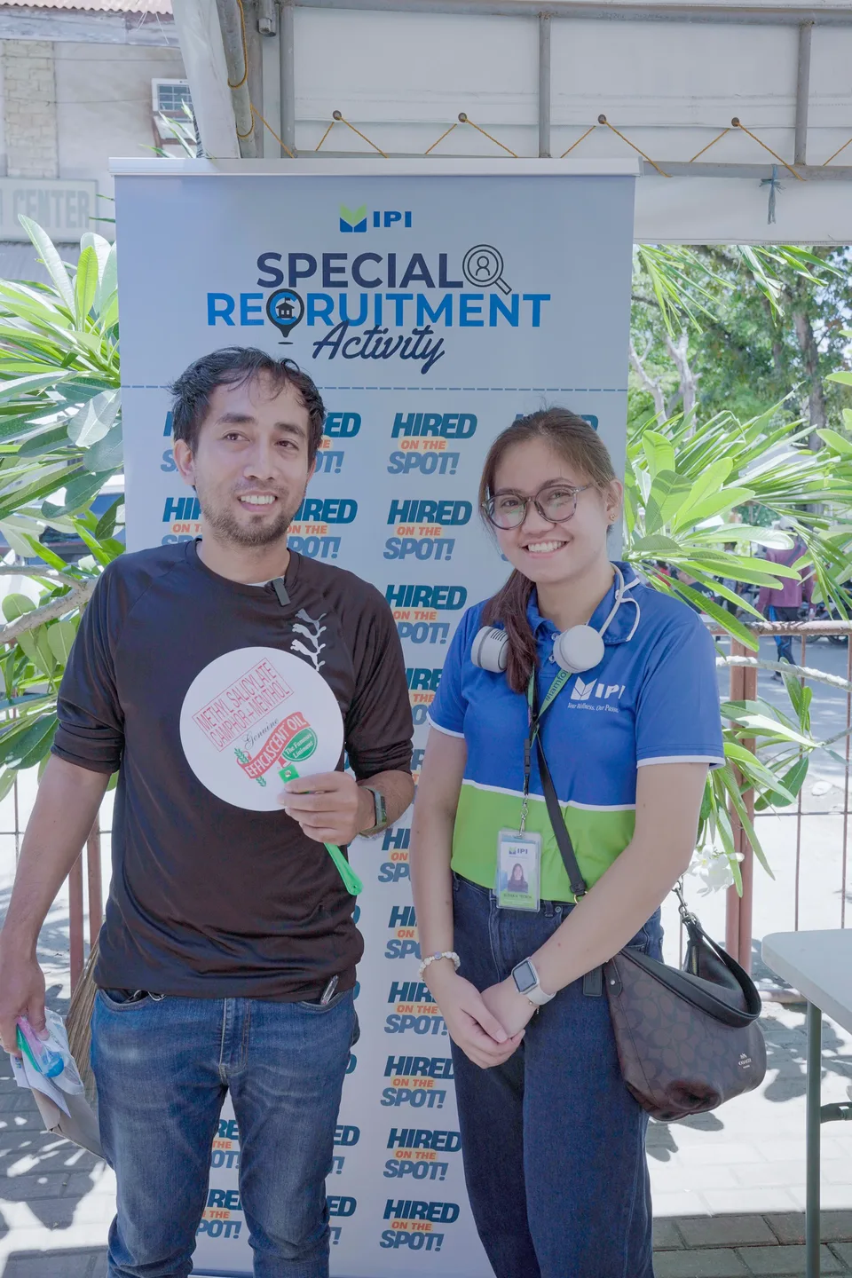 Applicants completing forms and meeting IPI recruiters at a PESO special recruitment activity held under tents in the city grounds