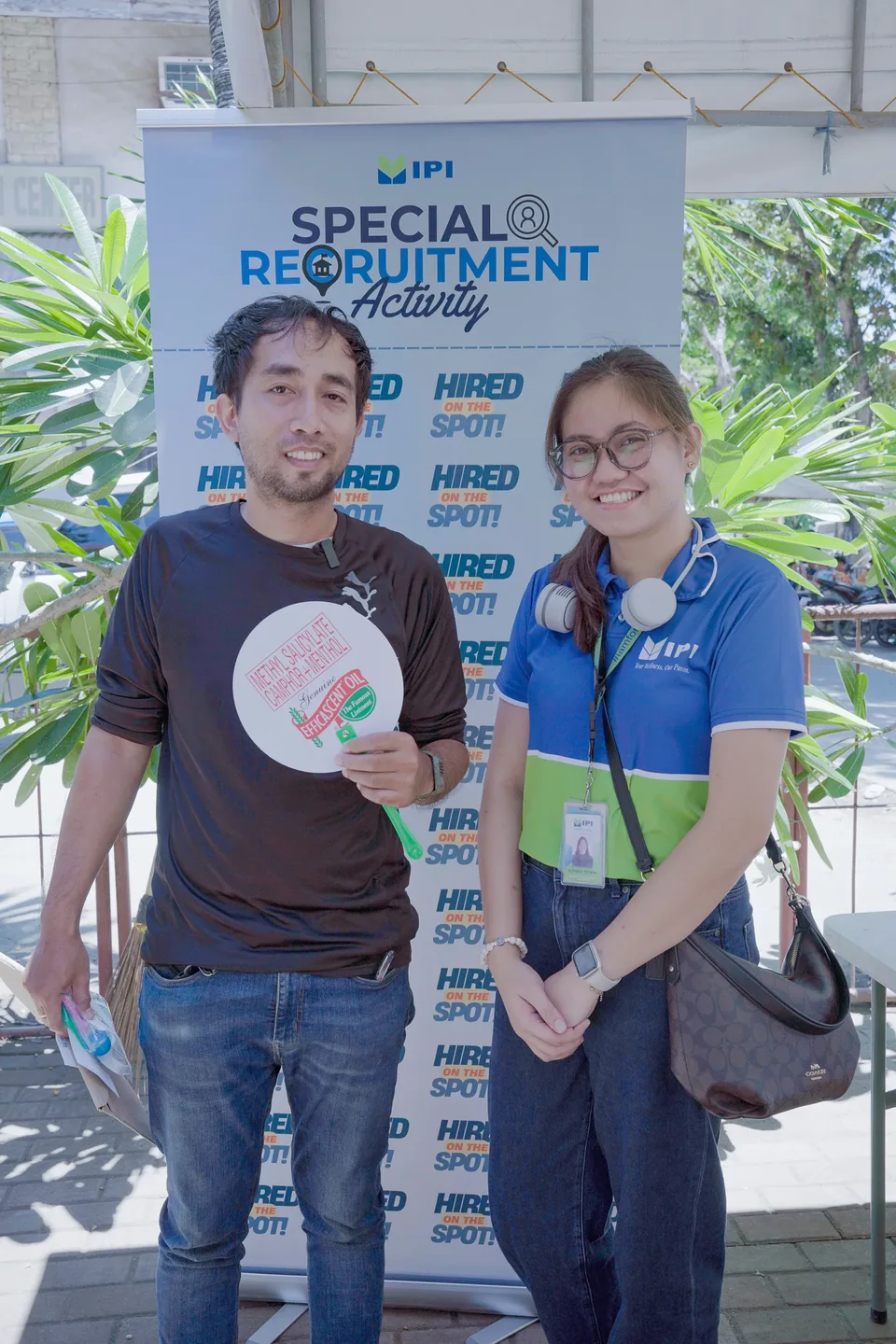 Applicants completing forms and meeting IPI recruiters at a PESO special recruitment activity held under tents in the city grounds